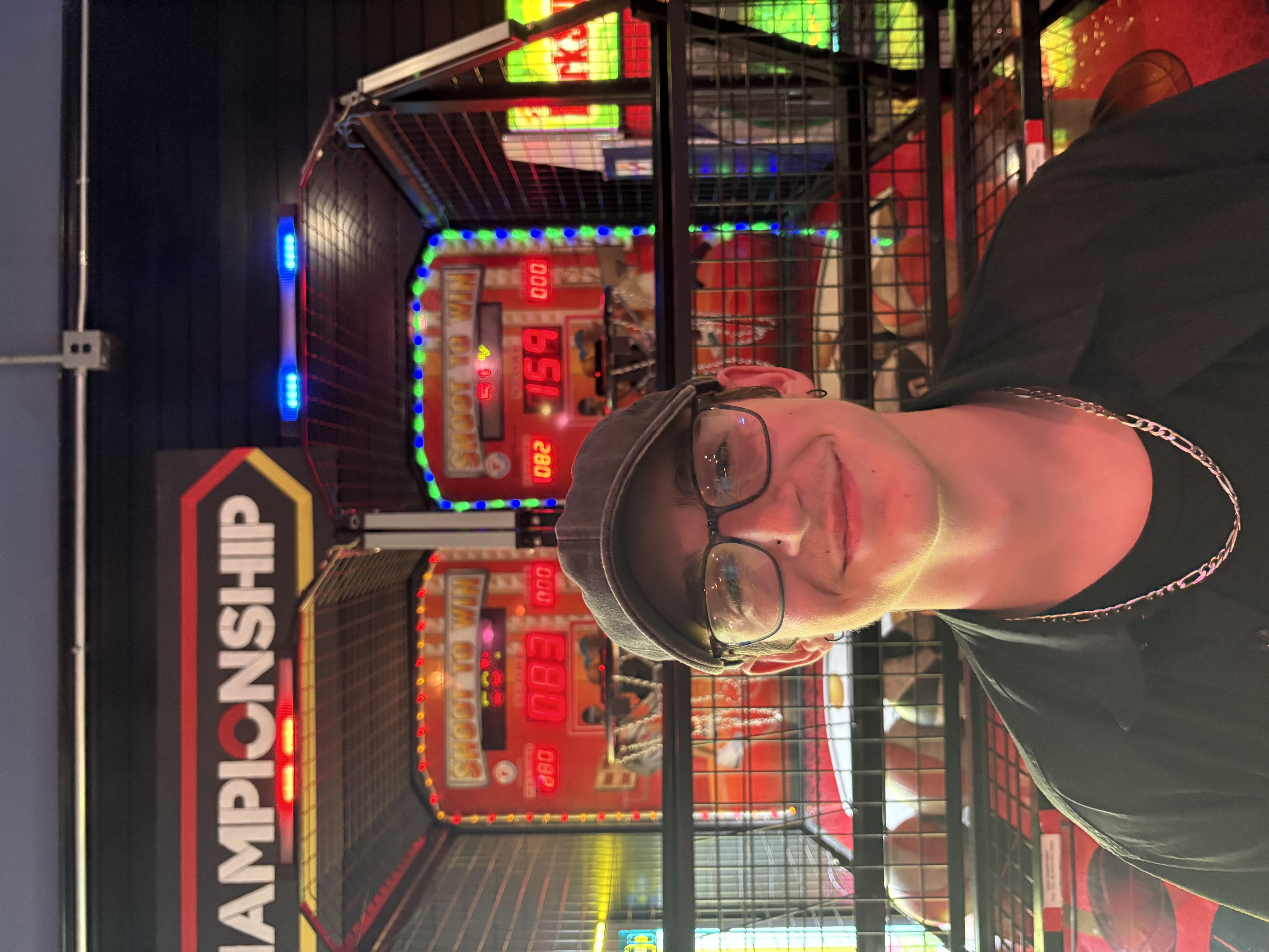 Image of Jonathan DW at an arcade.